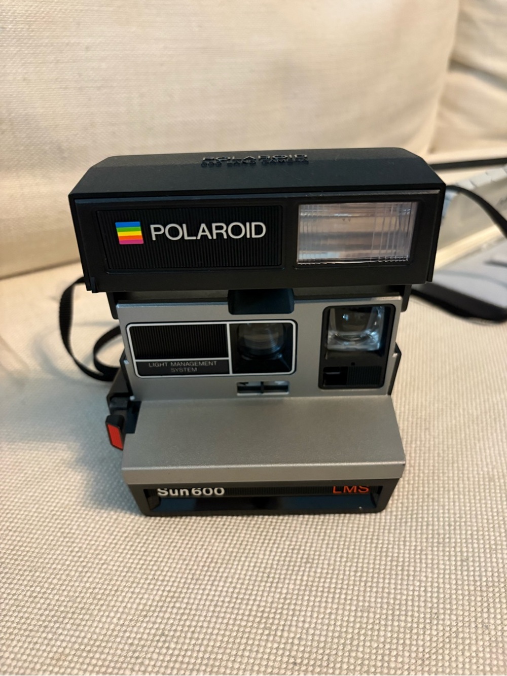 Polaroid Sun 600 LMS Instant Camera - Black and Silver with Rainbow Logo